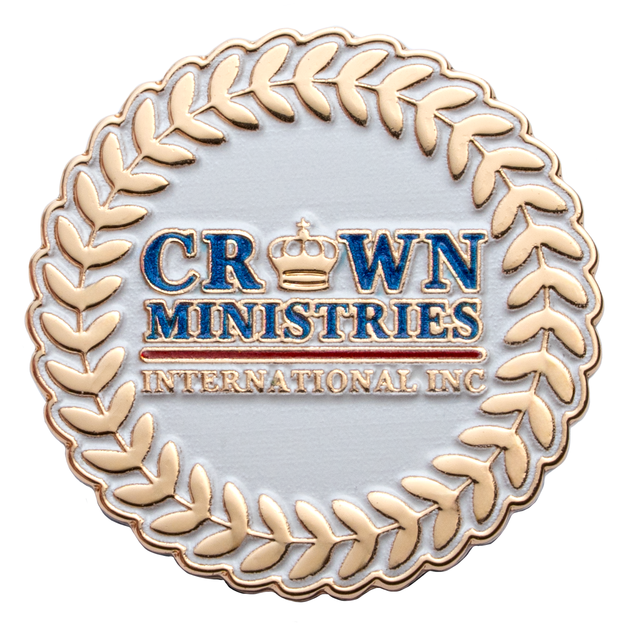 Round white and gold lapel pin for Crown Ministries International Inc with a crown emblem and laurel wreath border.