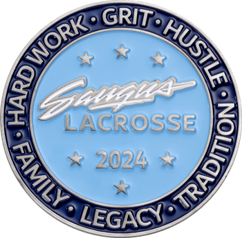 Saugus Lacrosse 2024 challenge coin featuring blue enamel with silver lettering and stars surrounded by a dark blue border with core values.