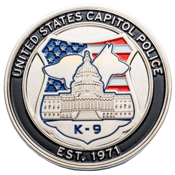 United States Capitol Police K-9 challenge coin featuring the US Capitol building and two K-9 dog silhouettes against an American flag background.