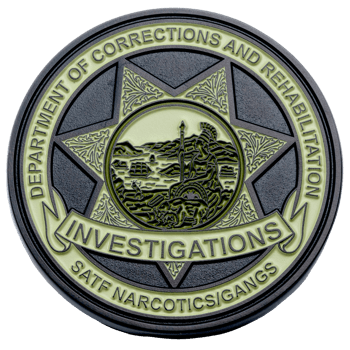Circular black and pale green challenge coin for Department of Corrections and Rehabilitation Investigations, SATF Narcotics/Gangs unit.