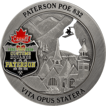 Antique silver challenge coin for Paterson POE 832 featuring Canadian customs shield, alpine church, skier cut-out, and Latin motto.
