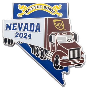 Enamel lapel pin shaped like the state of Nevada featuring a UPS delivery truck, the text Nevada 2024, and a Battle Born banner.