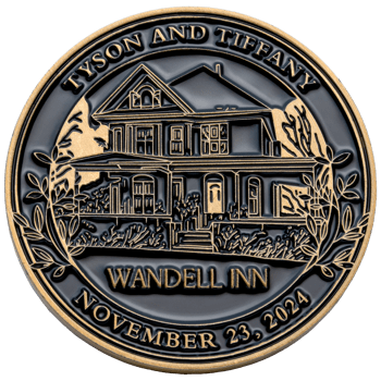Circular challenge coin featuring an architectural illustration of the Wandell Inn house with gold text and borders on a black background.