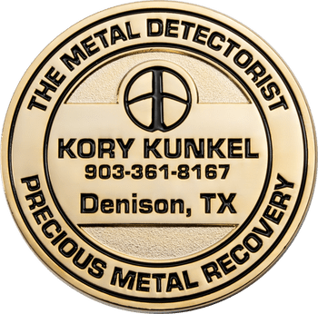 Gold challenge coin for The Metal Detectorist Precious Metal Recovery featuring a detector coil emblem and text