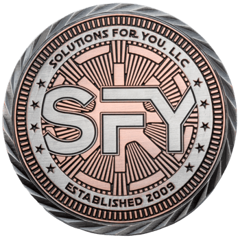 Dual-plated silver and copper challenge coin featuring the SFY logo and 'Solutions For You, LLC' text with an established date of 2009.