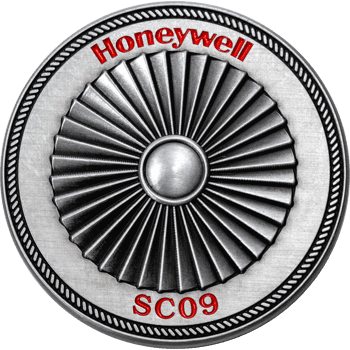 Antiqued silver challenge coin featuring a central turbine pattern with Honeywell and SC09 text in red enamel.
