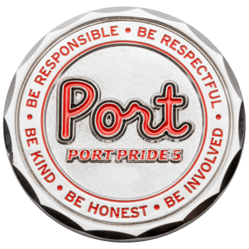 Silver challenge coin with red enamel featuring the word Port and values like Be Kind and Be Honest around the border.