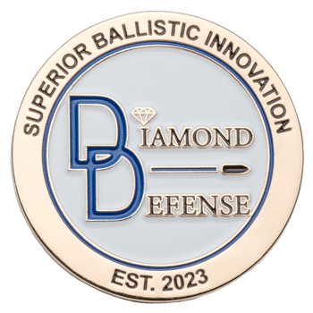 Gold and white challenge coin for Diamond Defense featuring a blue monogram, bullet icon, and the text Superior Ballistic Innovation.