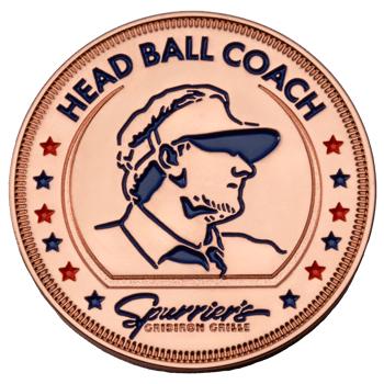 Copper challenge coin featuring a blue silhouette of a coach with the text Head Ball Coach and Spurrier's Gridiron Grille logo.