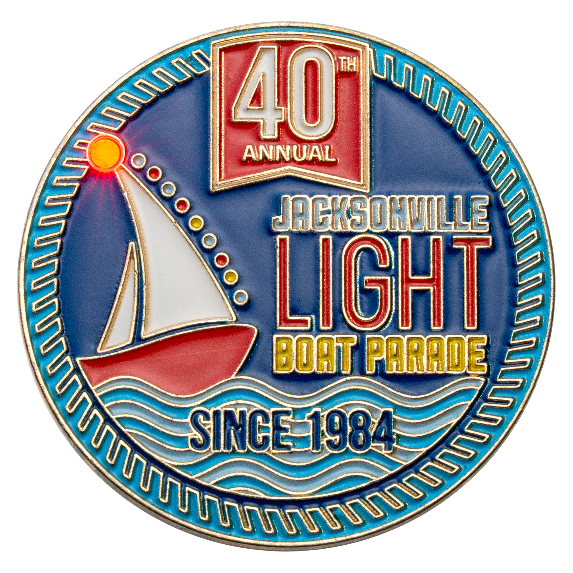 Circular lapel pin featuring a sailboat on waves with text for the 40th Annual Jacksonville Light Boat Parade since 1984 in blue, red, and gold enamel.