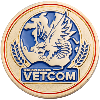 Gold challenge coin with blue enamel featuring an eagle, wheat stalks, and the text Textron Aviation VETCOM.
