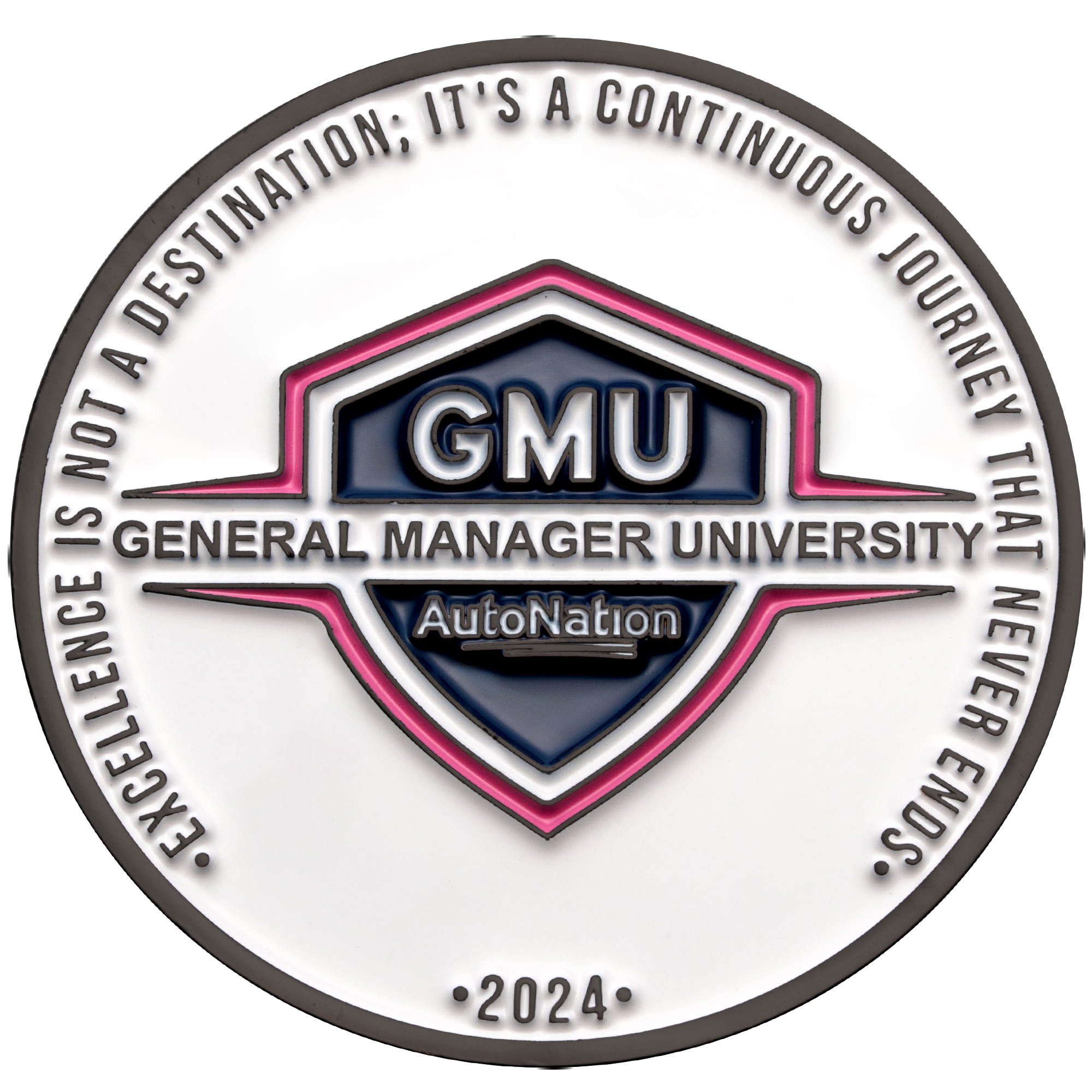 Circular challenge coin for General Manager University AutoNation 2024 featuring a shield emblem and excellence quote on white enamel.