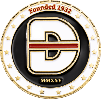 Custom challenge coin featuring a stylized white and gold D logo with a red stripe on a black background, surrounded by stars and text reading Founded 1932.