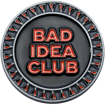 Bad Idea Club challenge coin with red lettering on a black background and a silver border with red and black triangular accents.