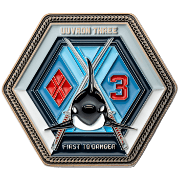 Hexagonal challenge coin for UUVRON THREE featuring an orca whale, a red diamond, and the number 3 against a blue background.