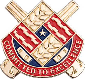 Gold heraldic shield lapel pin with red, white, and blue enamel detailing and the motto Committed to Excellence.