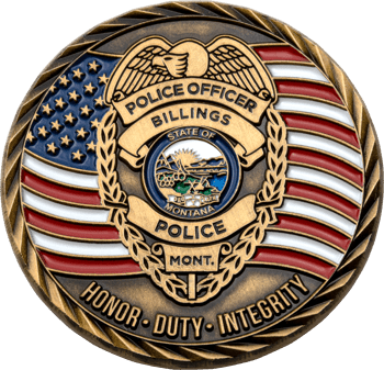 Antiqued gold challenge coin featuring a Billings Police Department badge over a waving American flag background with the words Honor, Duty, Integrity.